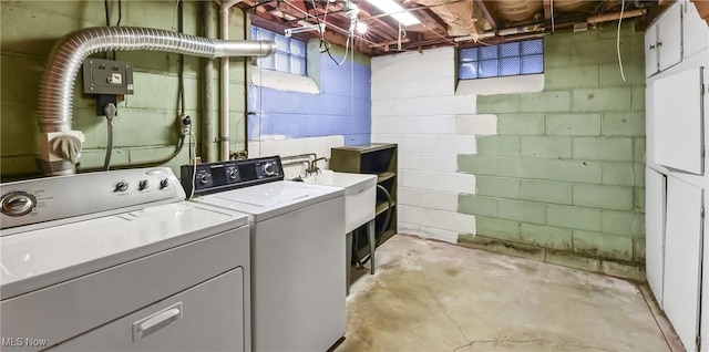 laundry room featuring separate washer and dryer and laundry area