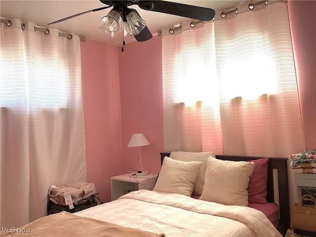 bedroom featuring multiple windows