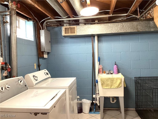 laundry room with light tile patterned floors, visible vents, laundry area, electric panel, and washer and dryer