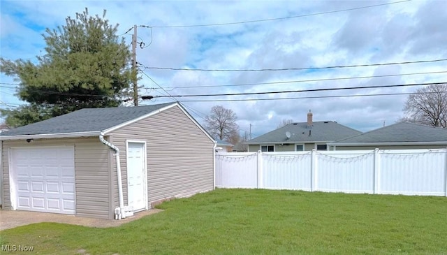 4707 Brookhigh Dr, Brooklyn, OH 44144 - view of yard with an outdoor structure, fence, and a detached garage
