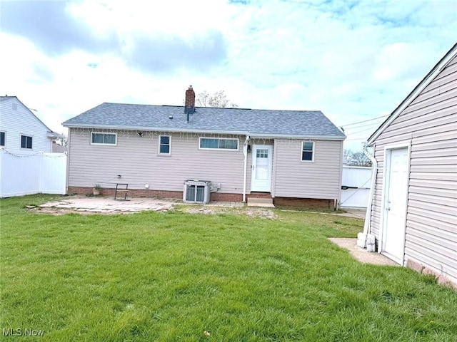 4707 Brookhigh Dr, Brooklyn, OH 44144 - back of property featuring roof with shingles, central air condition unit, a patio area, a yard, and fence