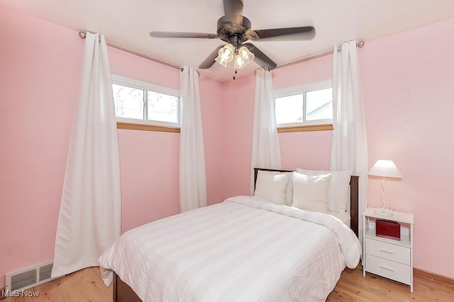 4707 Brookhigh Dr, Brooklyn, OH 44144 - bedroom with light wood finished floors, visible vents, and a ceiling fan