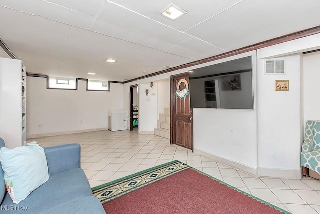 4707 Brookhigh Dr, Brooklyn, OH 44144 - living area featuring light tile patterned floors, visible vents, and baseboards