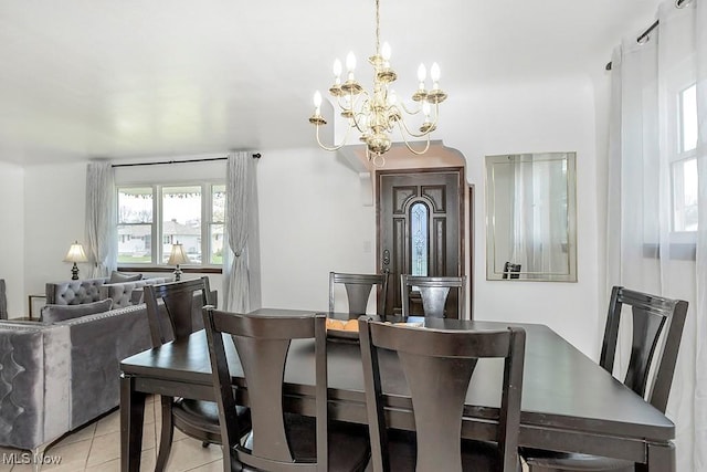 4707 Brookhigh Dr, Brooklyn, OH 44144 - dining room featuring light tile patterned floors and a notable chandelier