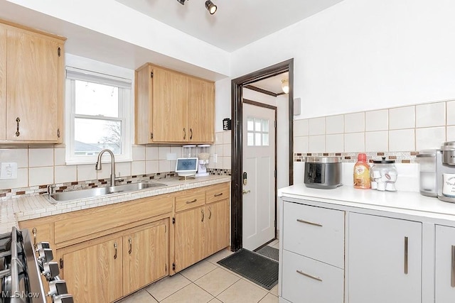 4707 Brookhigh Dr, Brooklyn, OH 44144 - kitchen featuring light brown cabinets, decorative backsplash, and a sink