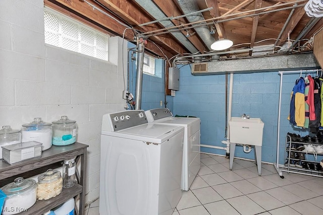 4707 Brookhigh Dr, Brooklyn, OH 44144 - washroom featuring a sink, light tile patterned floors, laundry area, and washing machine and clothes dryer
