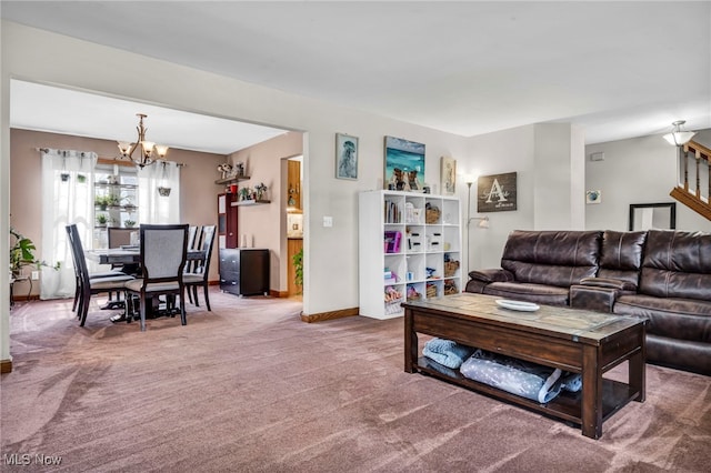 carpeted living area featuring stairway, a notable chandelier, and baseboards