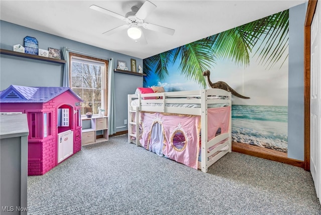 bedroom featuring baseboards, ceiling fan, and carpet flooring