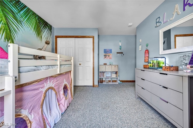 bedroom featuring a closet and baseboards