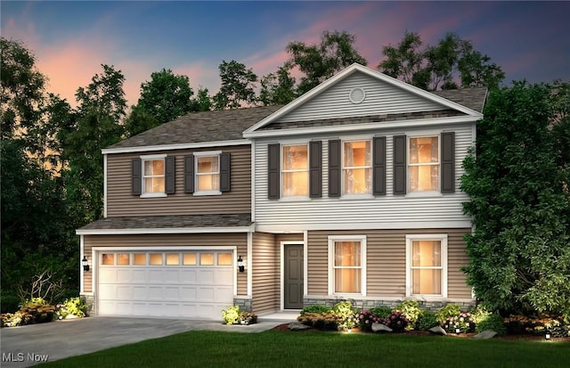 view of front of house featuring a garage, stone siding, and driveway