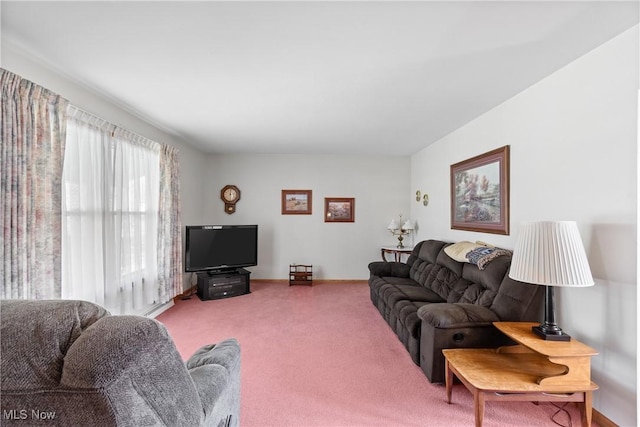 carpeted living room featuring baseboards