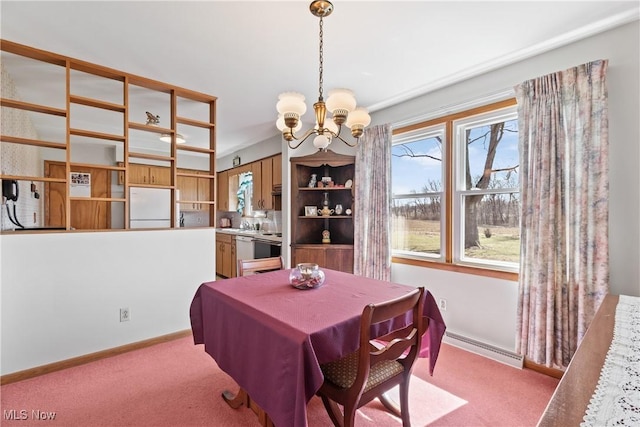 dining space featuring baseboards, light carpet, a chandelier, and a baseboard radiator