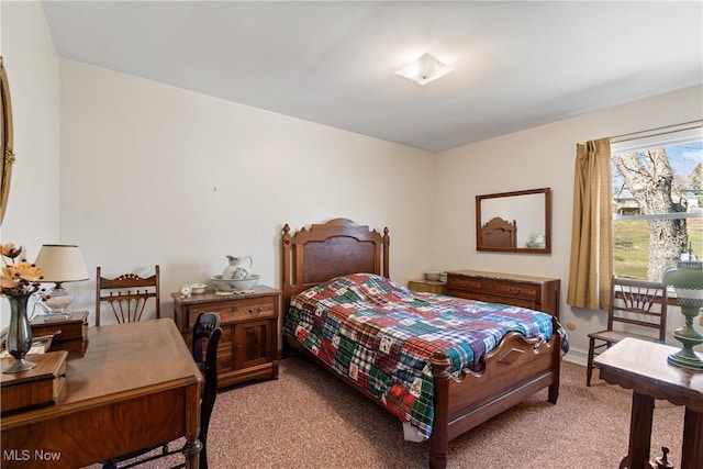 bedroom featuring light carpet