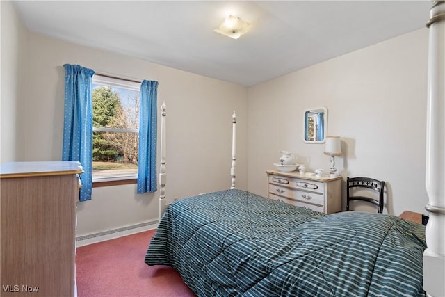 bedroom featuring baseboards, carpet, and a baseboard radiator