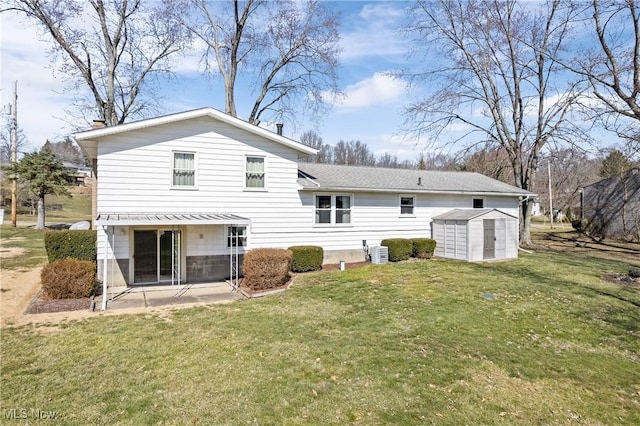 back of property featuring a lawn, central AC, an outdoor structure, and a shed