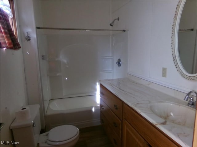 full bath with vanity, shower / bathing tub combination, and toilet