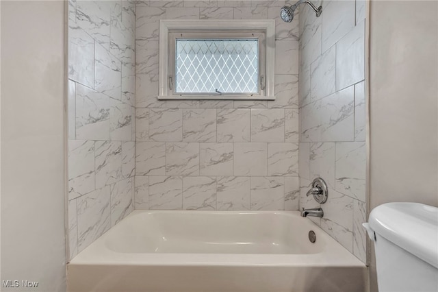 full bathroom featuring shower / tub combination and toilet