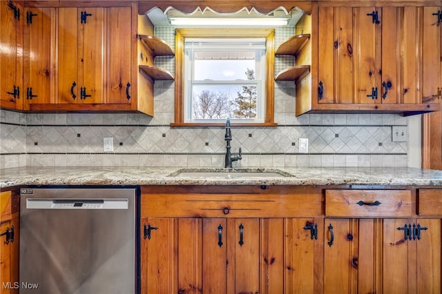 kitchen featuring brown cabinets, a sink, open shelves, tasteful backsplash, and dishwasher