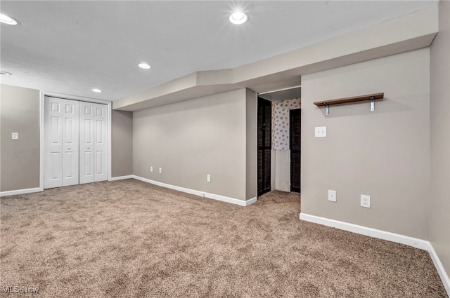 finished basement featuring recessed lighting, baseboards, and carpet flooring