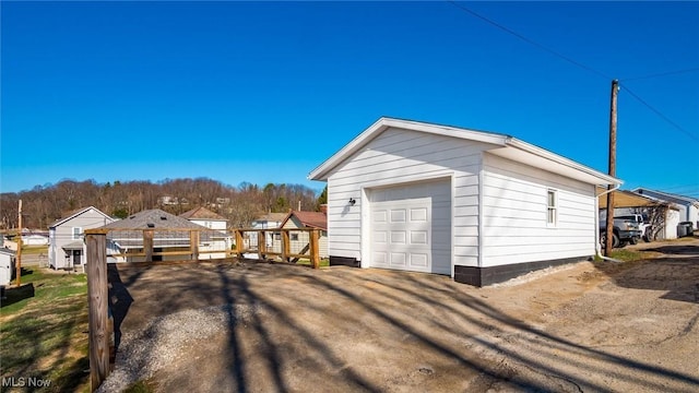 detached garage with a residential view