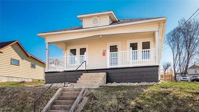 bungalow-style house with stairway and covered porch