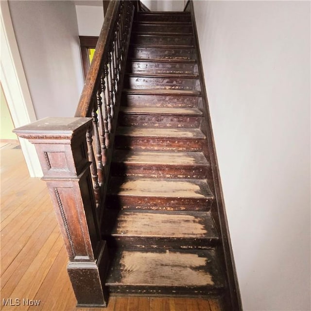 stairway featuring hardwood / wood-style flooring