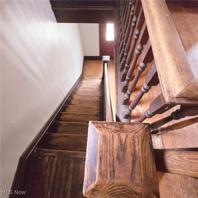 stairs with hardwood / wood-style flooring