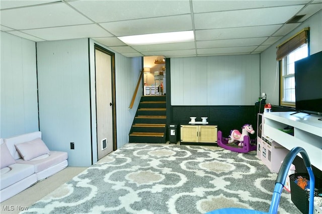 interior space featuring stairway and a drop ceiling