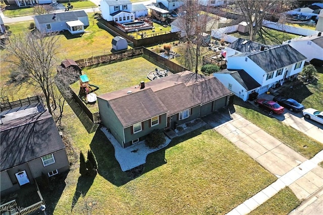 birds eye view of property with a residential view