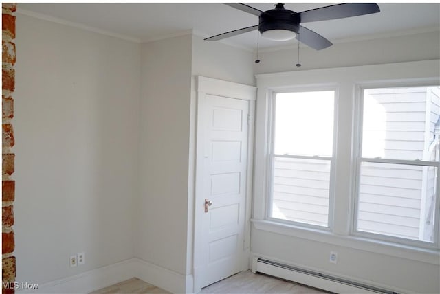 1341 Beach Ave, Lakewood, OH 44107 - interior space featuring ornamental molding, baseboards, ceiling fan, and a baseboard radiator