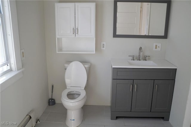 1341 Beach Ave, Lakewood, OH 44107 - bathroom with tile patterned floors, baseboard heating, vanity, and toilet