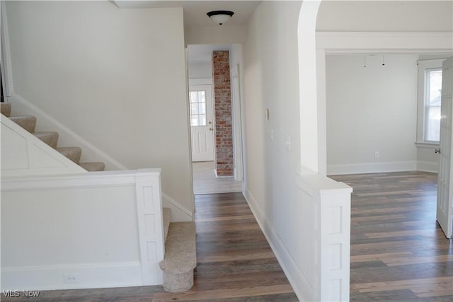 1341 Beach Ave, Lakewood, OH 44107 - corridor featuring plenty of natural light, stairs, and wood finished floors