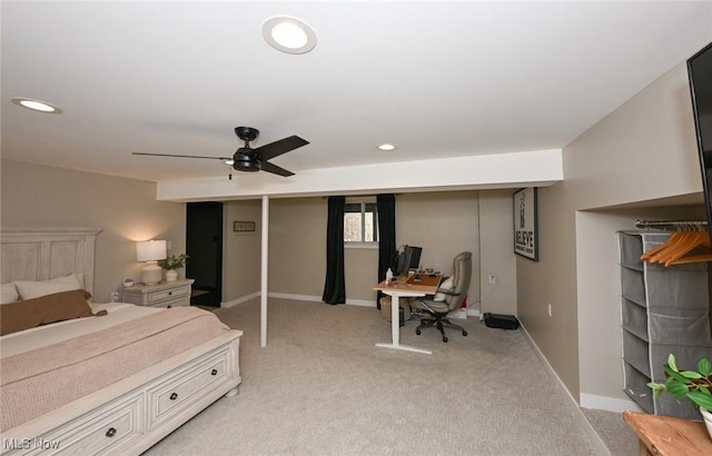 bedroom with recessed lighting, light colored carpet, baseboards, and ceiling fan