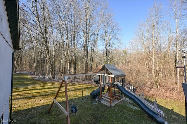 view of jungle gym featuring a lawn