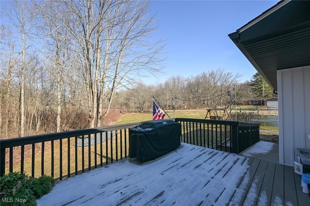 wooden deck featuring a yard