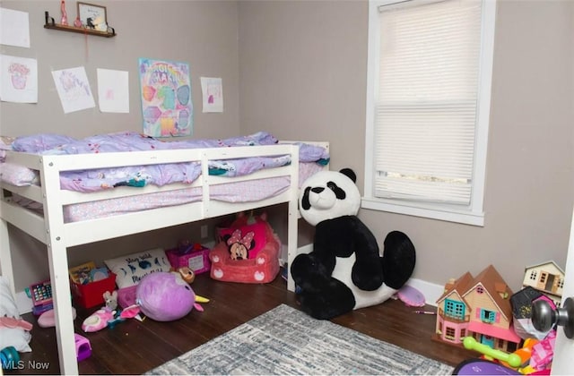 bedroom with wood finished floors