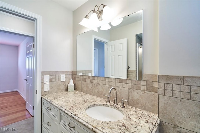 bathroom featuring backsplash and vanity