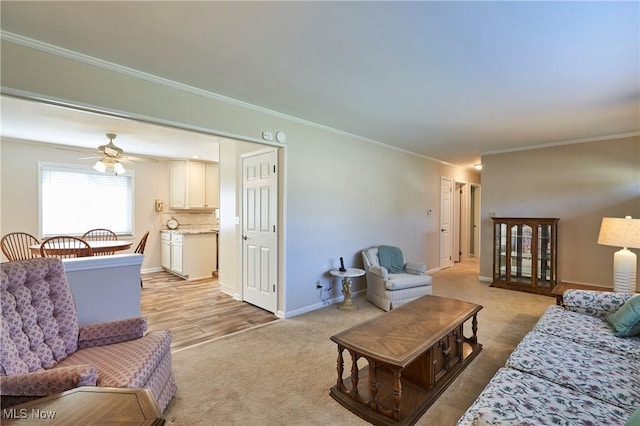 living room featuring light colored carpet, baseboards, and ornamental molding