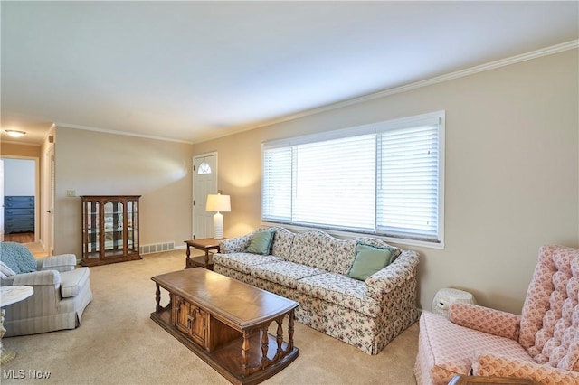 living area featuring crown molding, visible vents, and light carpet