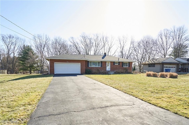 ranch-style home featuring brick siding, an attached garage, driveway, and a front lawn