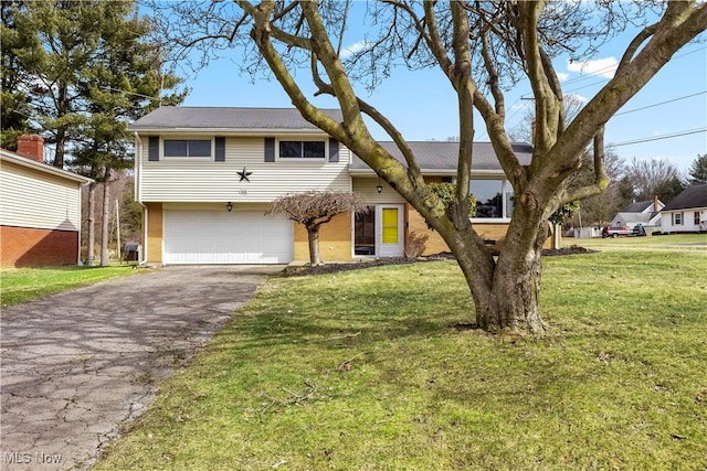 view of front of property featuring aphalt driveway, an attached garage, and a front lawn