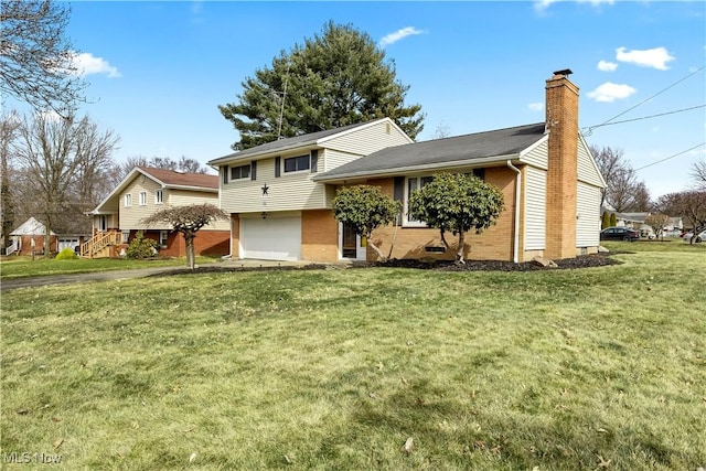 split level home featuring brick siding, an attached garage, a chimney, and a front lawn