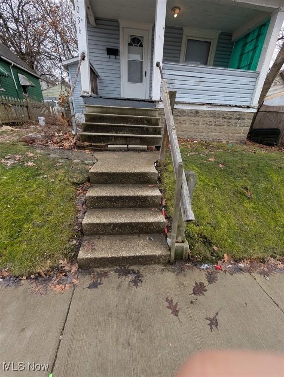 property entrance featuring covered porch