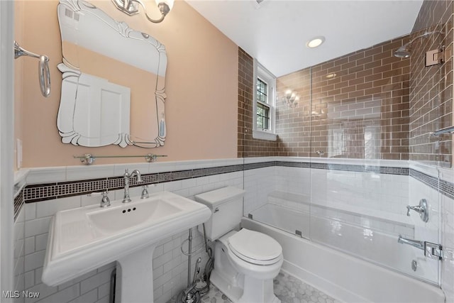 3006 Kingsley Rd, Shaker Heights, OH 44122 - full bath featuring toilet, a sink, combined bath / shower with glass door, tile walls, and wainscoting
