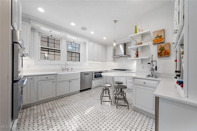3006 Kingsley Rd, Shaker Heights, OH 44122 - kitchen featuring decorative backsplash, dishwasher, light countertops, and wall chimney range hood