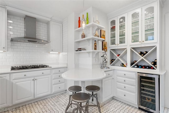 3006 Kingsley Rd, Shaker Heights, OH 44122 - kitchen with open shelves, gas cooktop, wine cooler, white cabinets, and wall chimney range hood