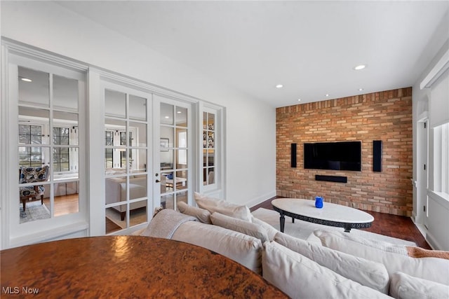 3006 Kingsley Rd, Shaker Heights, OH 44122 - living room with wood finished floors, baseboards, brick wall, recessed lighting, and french doors