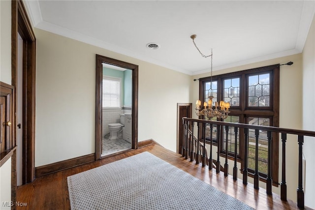 3006 Kingsley Rd, Shaker Heights, OH 44122 - corridor with visible vents, an upstairs landing, wood finished floors, crown molding, and baseboards