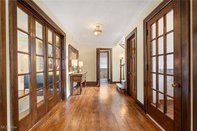3006 Kingsley Rd, Shaker Heights, OH 44122 - entryway featuring crown molding, baseboards, stairs, french doors, and dark wood-style floors