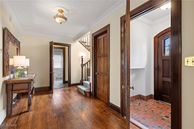 3006 Kingsley Rd, Shaker Heights, OH 44122 - foyer entrance featuring stairway, a healthy amount of sunlight, wood finished floors, and ornamental molding
